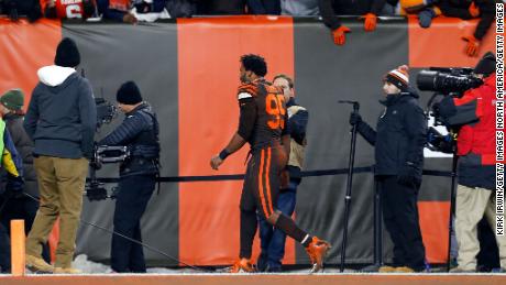 Garrett walks off of the field after being ejected.