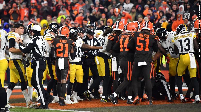 Steelers and Browns fight in the end zone near the end of the game.
