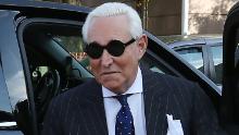 Roger Stone, former adviser to President Donald Trump, holds a bible as he arrives at the E. Barrett Prettyman United States Courthouse, on November 15, 2019 in Washington, DC.