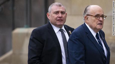 Rudy Giuliani, former mayor of New York, arrives with his associate Lev Parnas, left, before a state funeral service for former President George H.W. Bush at the National Cathedral in Washington, on Wednesday, December 5, 2018.