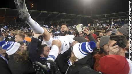Finnish captain Tim Sparv is carried aloft by fans after the historic win in Helsinki.