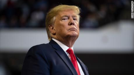 President Donald Trump listens as Louisiana Republican gubernatorial candidate Eddie Rispone speaks during a campaign rally at the CenturyLink Center, Thursday, Nov. 14, 2019, in Bossier City, La. (AP Photo/ Evan Vucci)