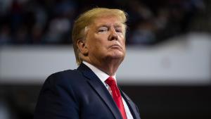 President Donald Trump listens as Louisiana Republican gubernatorial candidate Eddie Rispone speaks during a campaign rally at the CenturyLink Center, Thursday, Nov. 14, 2019, in Bossier City, La. (AP Photo/ Evan Vucci)