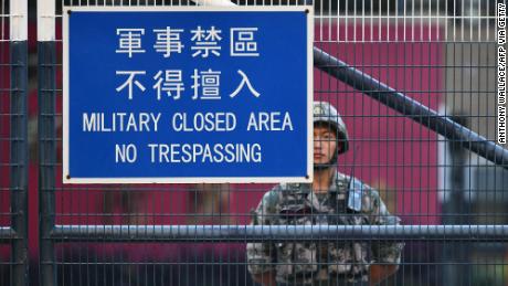 A member of Chinas People&#39;s Liberation Army (PLA) stands guard inside Osborn Barracks in Kowloon Tong in Hong Kong on November 16, 2019. 