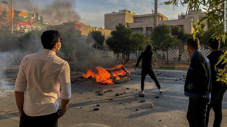 Protesters block a road in the central Iranian city of Shiraz on Saturday.