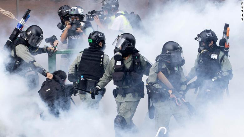 Police in riot gear move through a cloud of smoke as they detain a protester at the Hong Kong Polytechnic University in Hong Kong, on Monday, November 18. Police have &lt;a href=&quot;https://edition.cnn.com/asia/live-news/hong-kong-protests-live-nov-18-intl-hnk/index.html&quot; target=&quot;_blank&quot;&gt;attempted to clear the university&lt;/a&gt;, which has been occupied by protesters for days as a strategic protest base.
