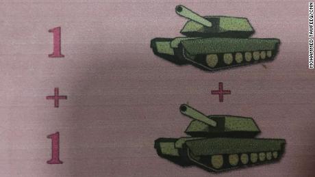 A schoolbook shows how tanks were used in an arithmetic lesson.