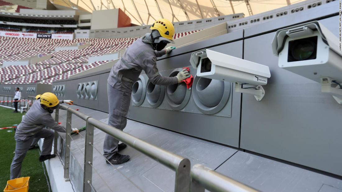 Workers cleaning the cooling system at the Khalifa International Stadium in Doha after it was refurbished ahead of the Qatar 2022 FIFA World Cup.