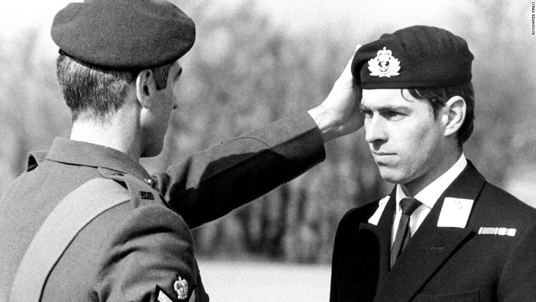 Prince Andrew receives a Green Beret award at an event in 1980. He served in the British Royal Navy for 22 years and was a helicopter pilot during the Falklands War.