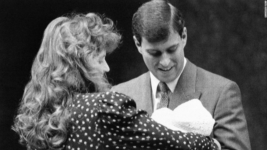 The couple holds their first child, Beatrice, in 1988. They had two children together before their high-profile divorce in 1996.