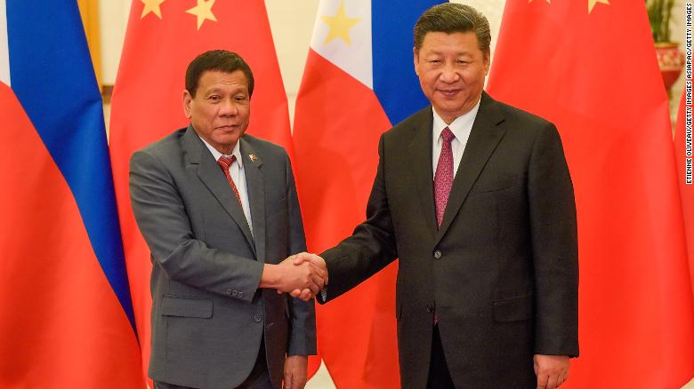 Chinese President Xi Jinping shakes hands with Philippine President Rodrigo Duterte on May 15, 2017 in Beijing.