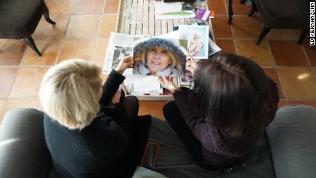 Helene de Ponsay shows a CNN reporter a photo of her murdered sister, Marie-Alice Dibon.