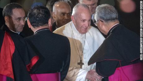 Pope Francis is greeted by senior members of the Japanese Catholic Church as he arrives in Tokyo.