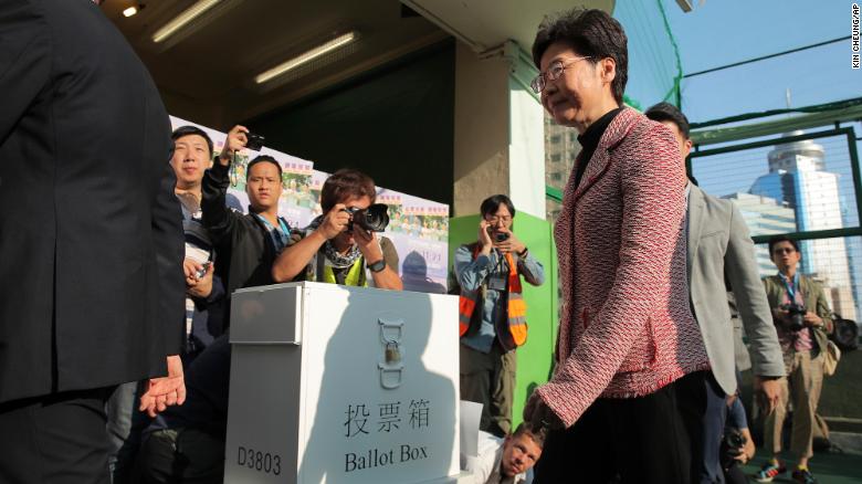 Hong Kong Chief Executive Carrie Lam leaves after casting her ballot at a polling place in Hong Kong, Sunday, Nov. 24, 2019. Voting was underway Sunday in Hong Kong elections that have become a barometer of public support for anti-government protests now in their sixth month. (AP Photo/Kin Cheung)