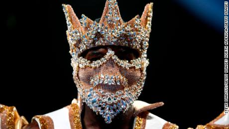 Showtime ... WBC heavyweight champion Deontay Wilder enters the ring for the start of his title fight against Luis Ortiz.