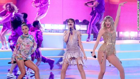 From left, Halsey, Camila Cabello and Taylor Swift perform during the 2019 American Music Awards on Sunday.