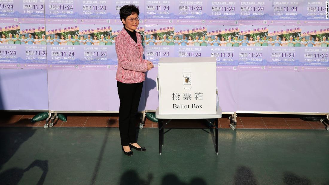 Hong Kong Chief Executive Carrie Lam casts her ballot for the district council elections at a polling place, November 24. In a statement Monday, Lam said her government &quot;respects the election results.&quot;