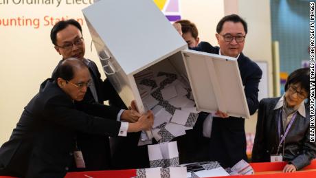 HONG KONG, CHINA - NOVEMBER 24: Barnabus Fung (2nd R) and Patrick Nip Tak-kuen (2nd L) empty a ballot box to count votes at a polling station on November 24, 2019 in Hong Kong, China. Hong Kong held its district council election on Sunday as anti-government protests continue into a sixth month, with demands for an independent inquiry into police brutality, the retraction of the word &quot;riot&quot; to describe the rallies, and genuine universal suffrage. (Photo by Billy H.C. Kwok/Getty Images)