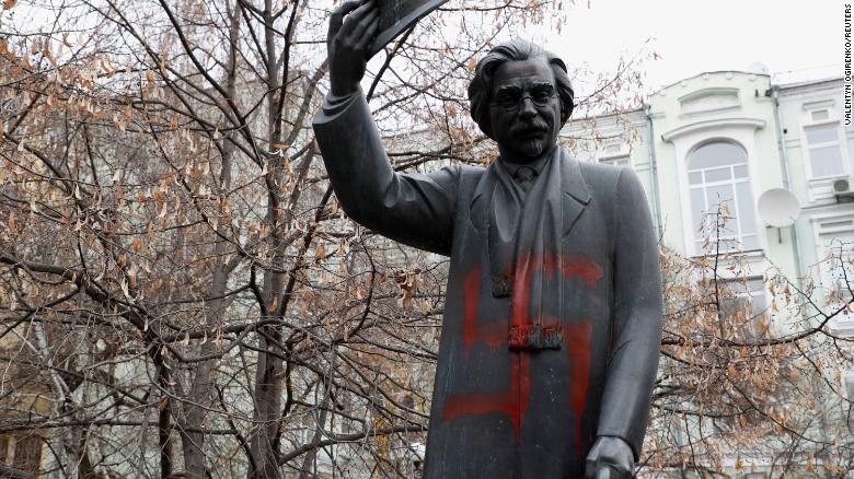 A monument to Yiddish author Sholem Aleichem is seen vandalized with swastikas in Kiev, Ukraine