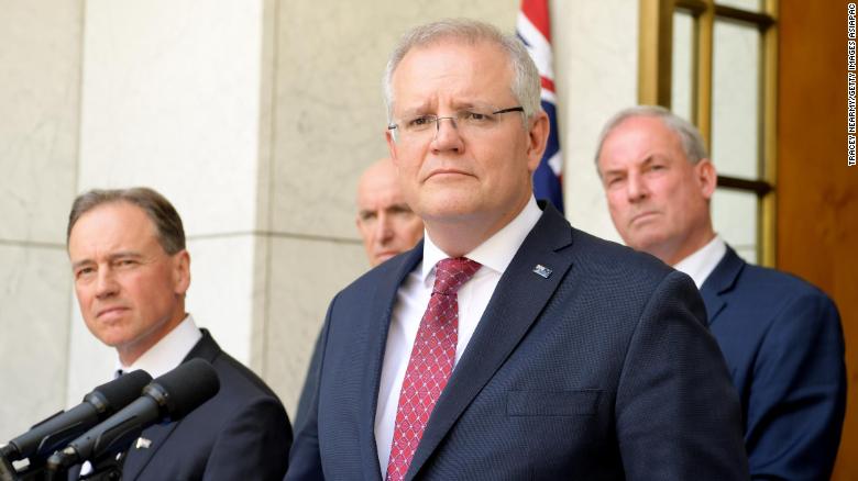 Prime Minister Scott Morrison (C) speak to media during a press conference at Parliament House on November 25 in Canberra, Australia.