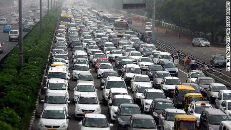 Traffic stretches back in Hero Honda chowk as waterlogging during monsoon downpours causes traffic jams in Gurgaon on July 29, 2016. 
Thousands of Indians were left stranded overnight July 29, as major traffic gridlock paralysed roads leading to a key business city near New Delhi and authorities struggled to get the situation under control. / AFP / STRINGER        (Photo credit should read STRINGER/AFP via Getty Images)