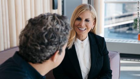 Spotify&#39;s Chief Content and Advertising Business Officer Dawn Ostroff speaks with a colleague at the company&#39;s headquarters in New York City in 2019. (Celeste Sloman for CNN)