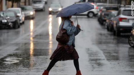 A woman walking in the rain in San Francisco Tuesday