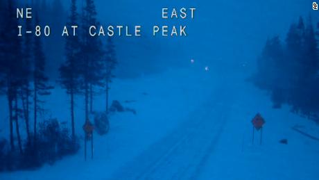 In this still image taken from a Caltrans remote video traffic camera, eastbound Interstate 80 is empty Wednesday morning because of closures and restrictions in Soda Springs, California.