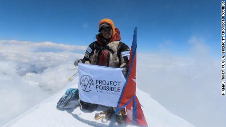 Purja at the summit of the 8,586-meter-tall Kanchenjunga, the world&#39;s third highest mountain.