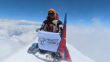 Purja at the summit of the 8,586-meter-tall Kanchenjunga, the world&#39;s third highest mountain.