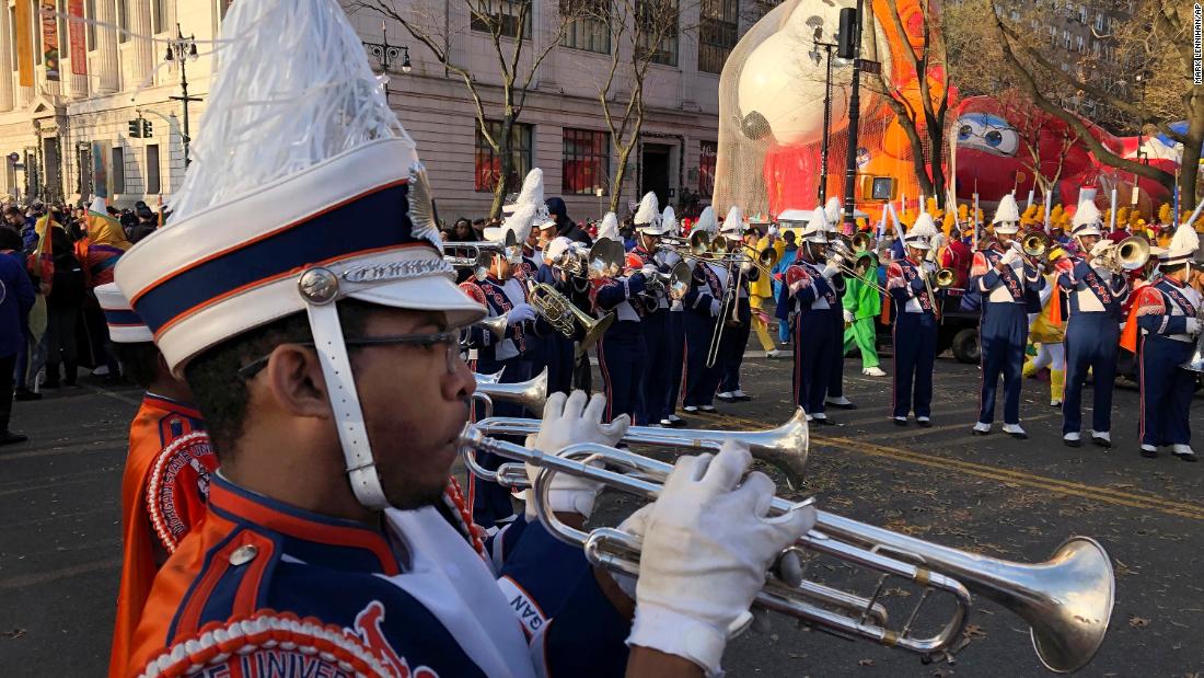 James Leach plays the trumpet as parade participants assemble at the start.