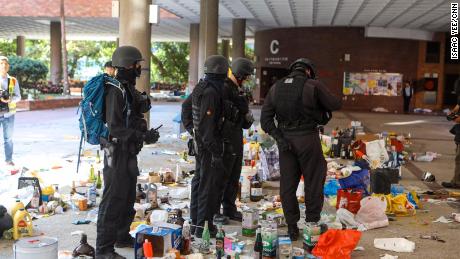 Police are seen standing by unused petrol bombs on the Hong Kong Polytechnic University campus on Thursday, November 28.