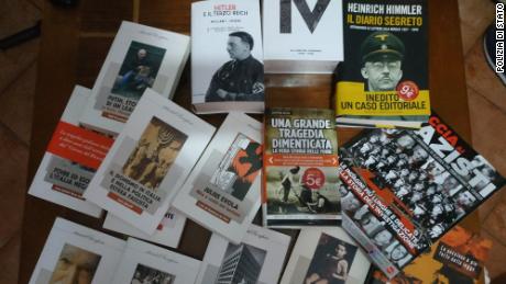 Police searched 19 homes across Italy and found books, plaques and flags with images of Adolf Hitler and Benito Mussolini.