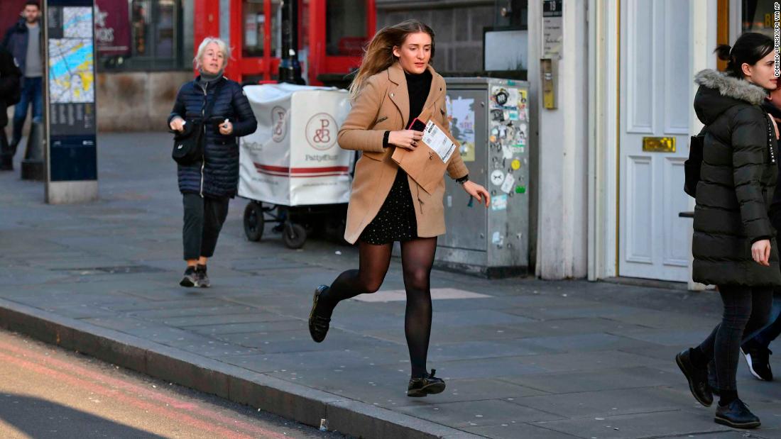 A woman runs from the London Bridge area.