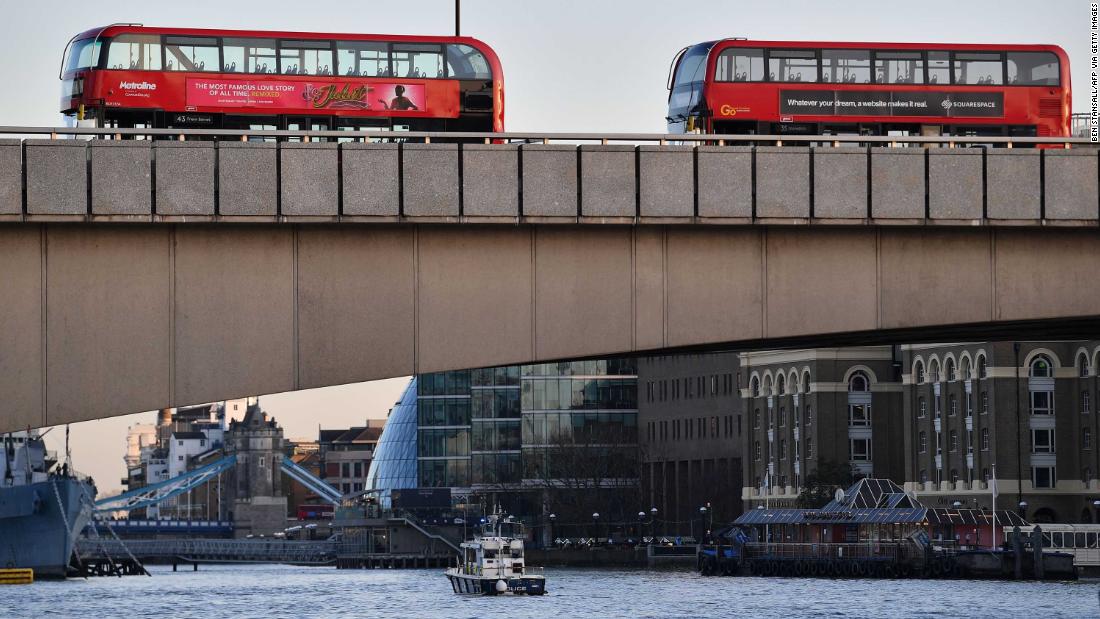Empty buses are seen parked on London Bridge.