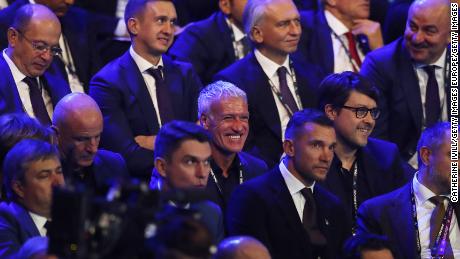 France manager Didier Deschamps (center) laughs as the Euro 2020 draw was made.  