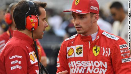 Ferrari&#39;s Monegasque driver Charles Leclerc (R) chats with an engineer on the grid at the Yas Marina Circuit in Abu Dhabi, ahead of the final race of the season, on December 1, 2019. (Photo by ANDREJ ISAKOVIC / AFP) (Photo by ANDREJ ISAKOVIC/AFP via Getty Images)