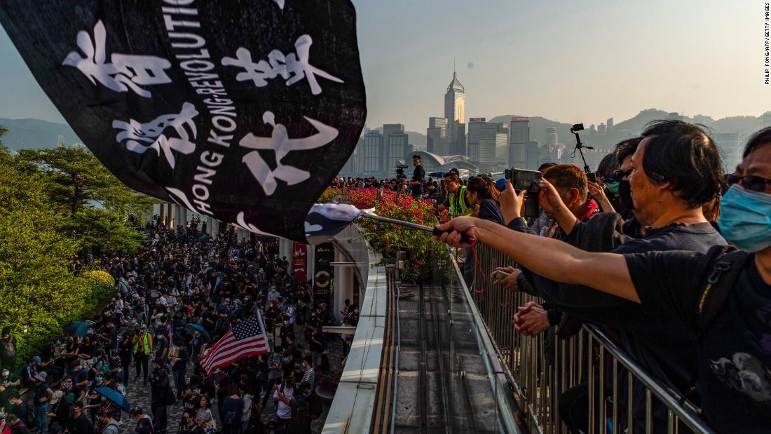 People take part in a march from Tsim Sha Tsui to Hung Hom in Hong Kong on December 1.