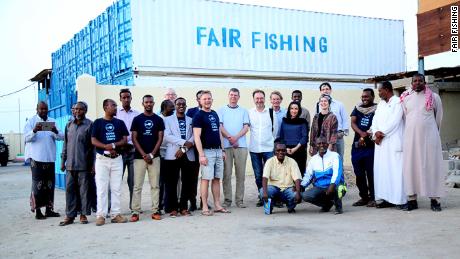 Some of the FairFishing staff, including local management, board members and fishers, gathered outside the fish station in Berbera, Somaliland. 