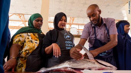 A FairFishing chef, Suleiman Farah, at a &#39;Fresh Fish on the Dish&#39; training, where female householders, chefs and fish mongers learn how to handle and prepare fish. 