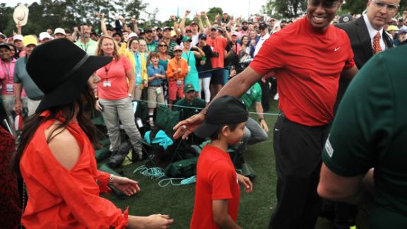 Tiger Woods celebrates with his son Charlie after winning his fifth Masters title.