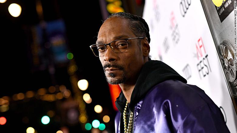 Snoop Dogg has got his mind on his money and his money on some wine.