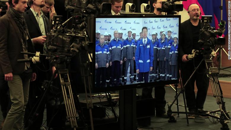 A screen shows Alexei Miller, head of Russia&#39;s gas giant Gazprom, as Russian President Vladimir Putin takes part in a ceremony inaugurating the &quot;Power of Siberia&quot; pipeline via a video link in Sochi on December 2.