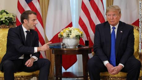 US President Donald Trump (R) France&#39;s President Emmanuel Macron react as they talk during their meeting at Winfield House, London on December 3, 2019. - NATO leaders gather Tuesday for a summit to mark the alliance&#39;s 70th anniversary but with leaders feuding and name-calling over money and strategy, the mood is far from festive. (Photo by ludovic MARIN / various sources / AFP) (Photo by LUDOVIC MARIN/AFP via Getty Images)