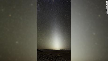 On clear nights, we can see a hint of dust around the sun as a concentrated illuminated cloud appears over the horizon, scattering the sun&#39;s light back to us in the dark. 