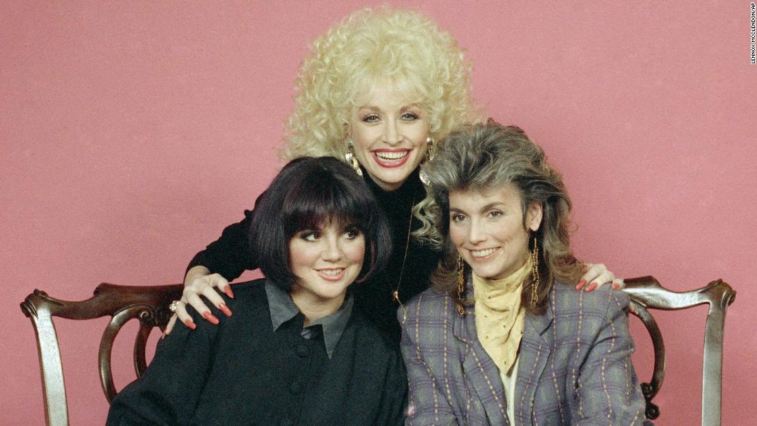 Ronstadt had known country superstars Dolly Parton and Emmylou Harris (center and right) for years by the time the three decided to release the album &quot;Trio.&quot; The record, which arrived in 1987, went platinum; gave the stars another No. 1 with &quot;To Know Him Is To Love Him&quot;; and won a Grammy for best country performance by a duo or a group. 