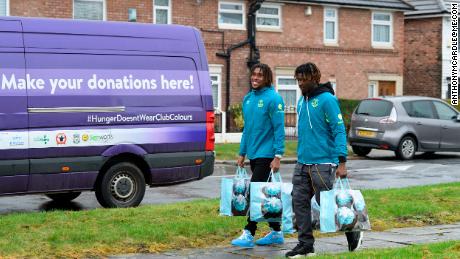 Everton duo Alex Iwobi and Moise Kean visit North Liverpool food bank.