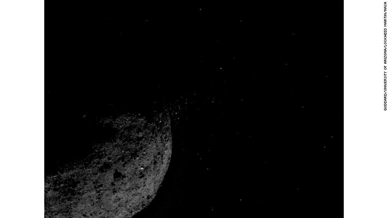 Particles can be seen releasing from the asteroid.