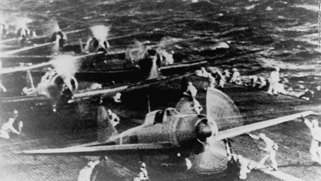 Crewmen of a Japanese aircraft carrier prepare fighter planes before the raid on Pearl Harbor.