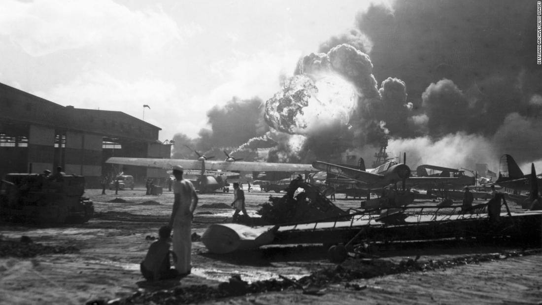 Airmen at Hickam Field watch as bombs explode. The Hickam Field airbase was heavily targeted during the attack, and Japanese bombers sought to prevent counter-attacks from US forces by disabling American planes on the ground.